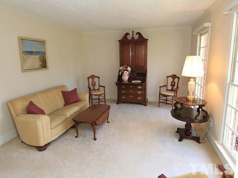 5016 Trail Ridge Drive Raleigh, NC 27613 - Photo 5 of 25 a living room with furniture and a lamp