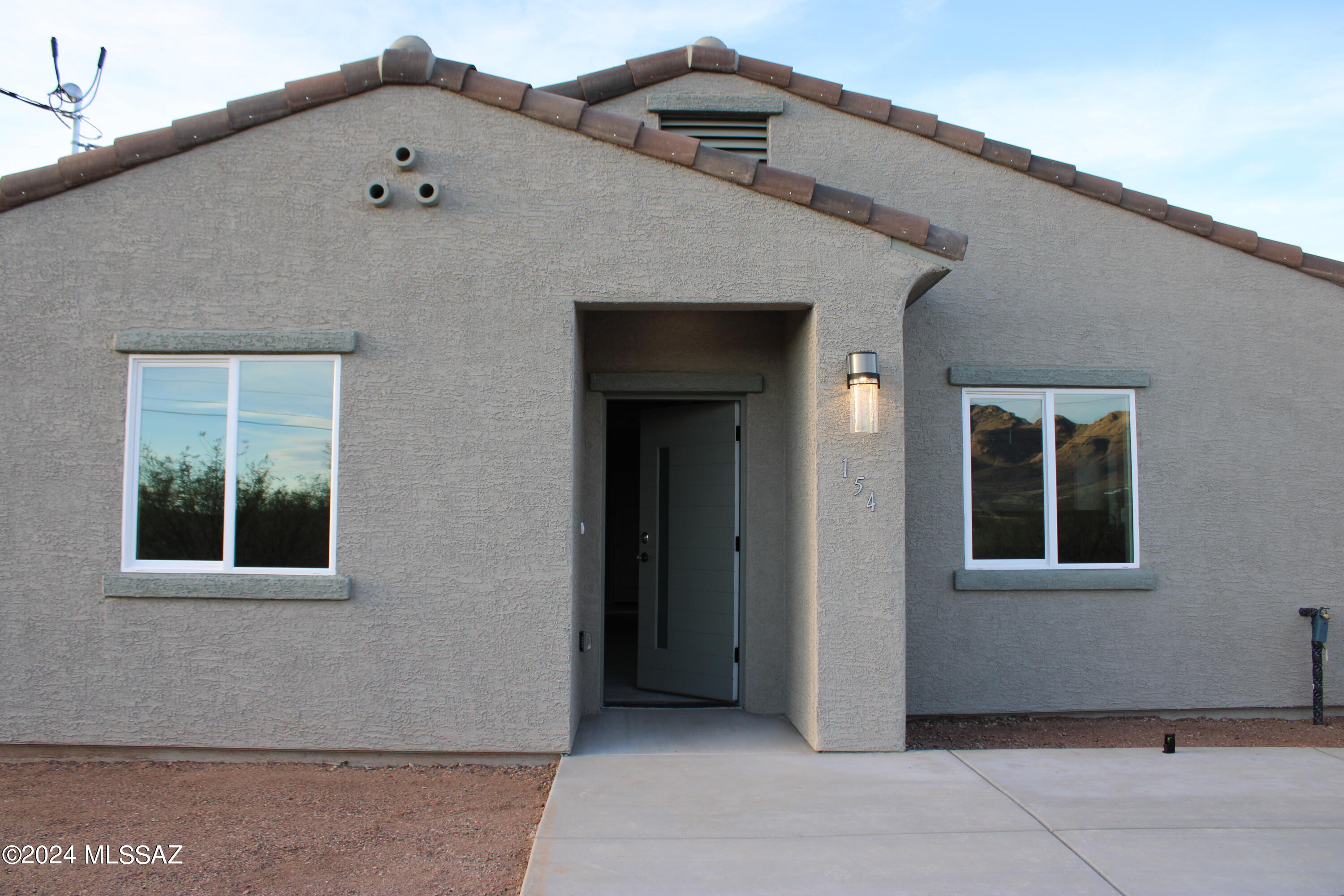 154 Calle Victoria Rio Rico, AZ 85648 - Photo 25 of 27 a front view of a house