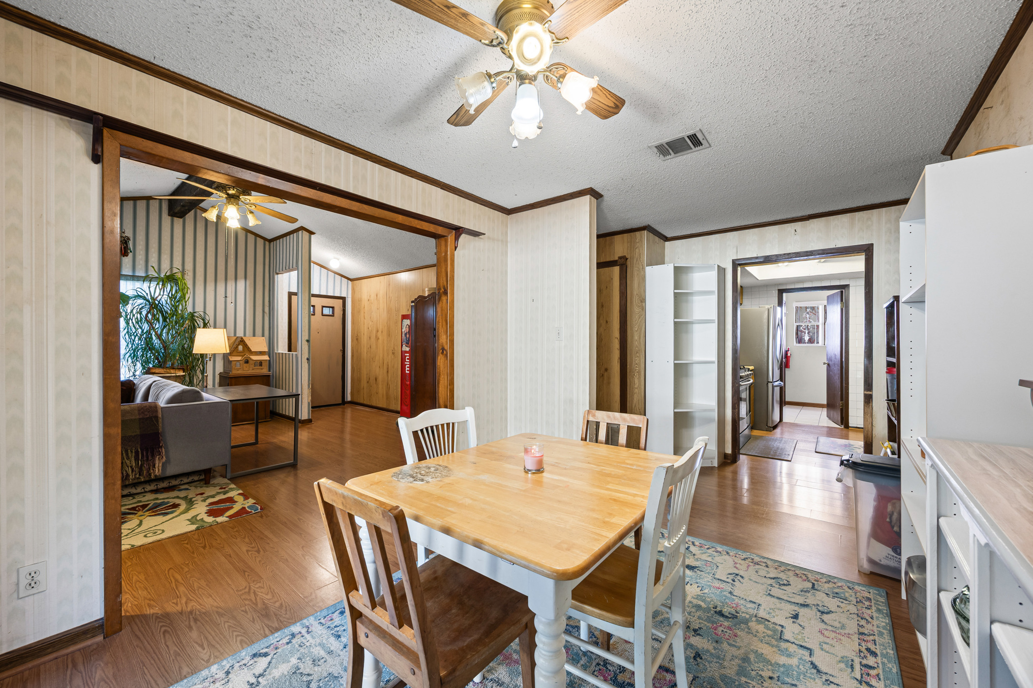 6300 Libyan Drive Austin, TX 78745 - Photo 12 of 35 a dining room with wooden floor and a chandelier