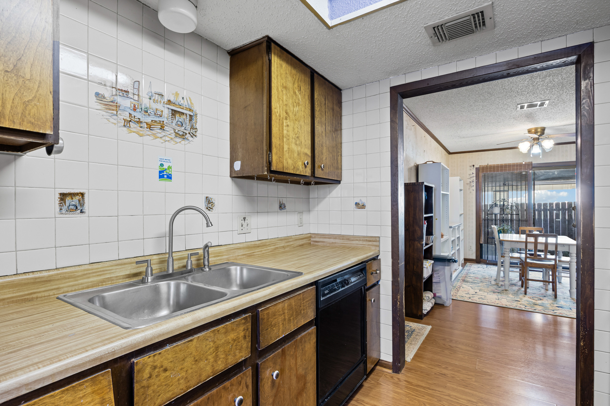 6300 Libyan Drive Austin, TX 78745 - Photo 15 of 35 a kitchen with a sink cabinets and wooden floor