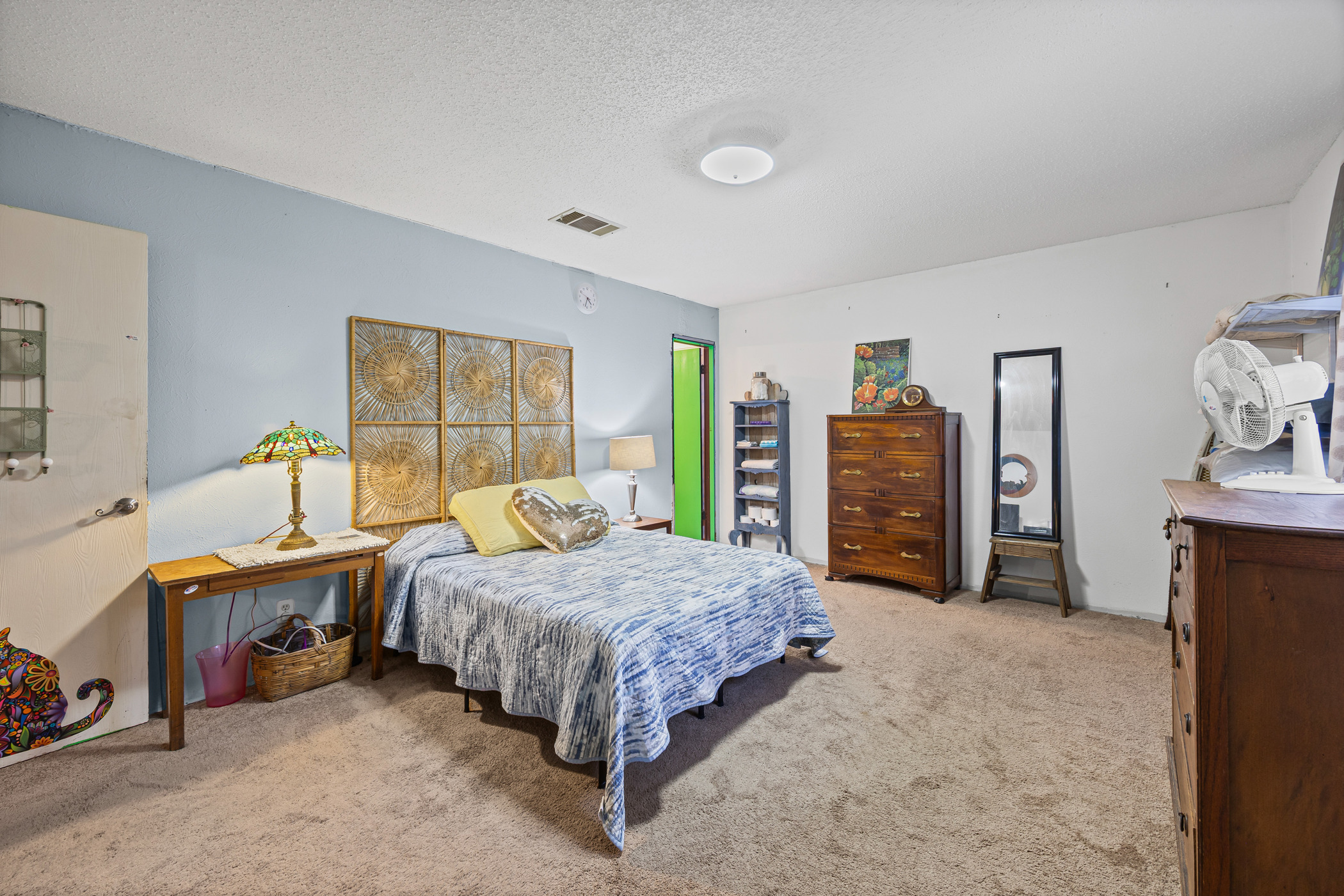 6300 Libyan Drive Austin, TX 78745 - Photo 20 of 35 a bedroom with a bed and a dresser