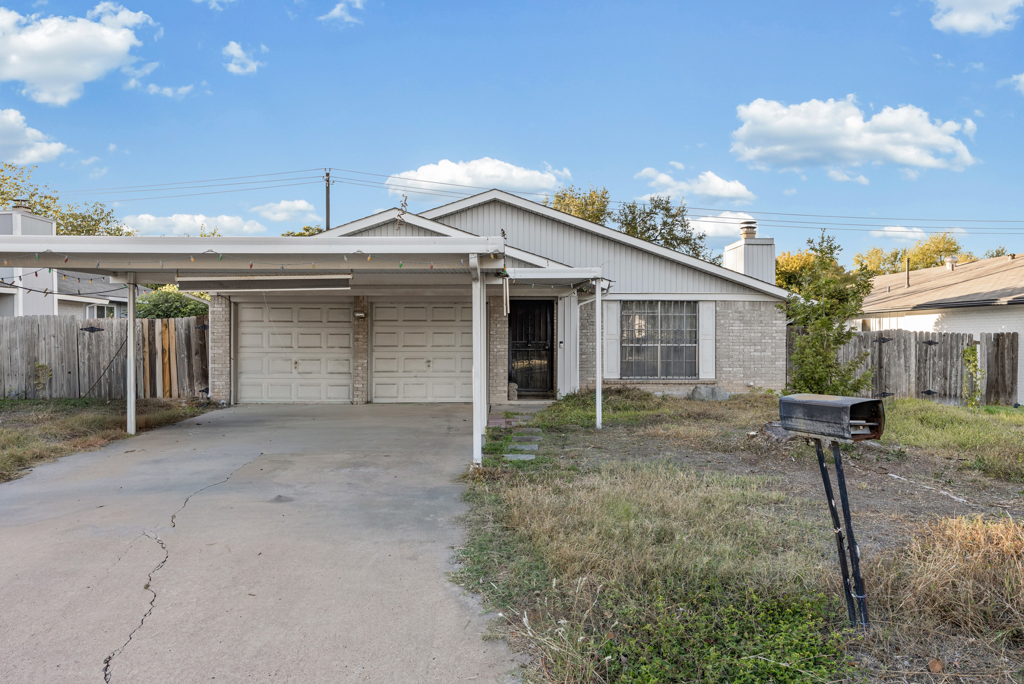 6300 Libyan Drive Austin, TX 78745 - Photo 2 of 35 a view of a house with a backyard and a tree