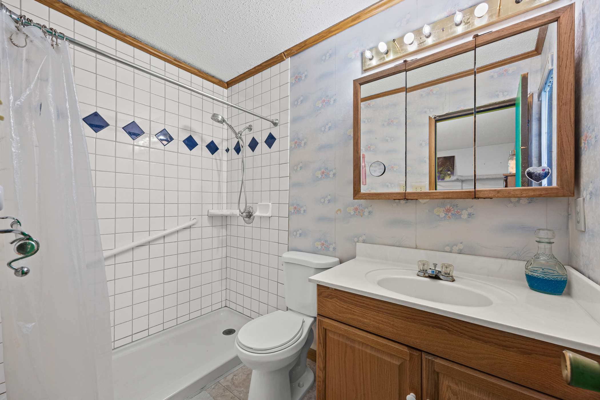 6300 Libyan Drive Austin, TX 78745 - Photo 22 of 35 a bathroom with a sink a toilet and shower