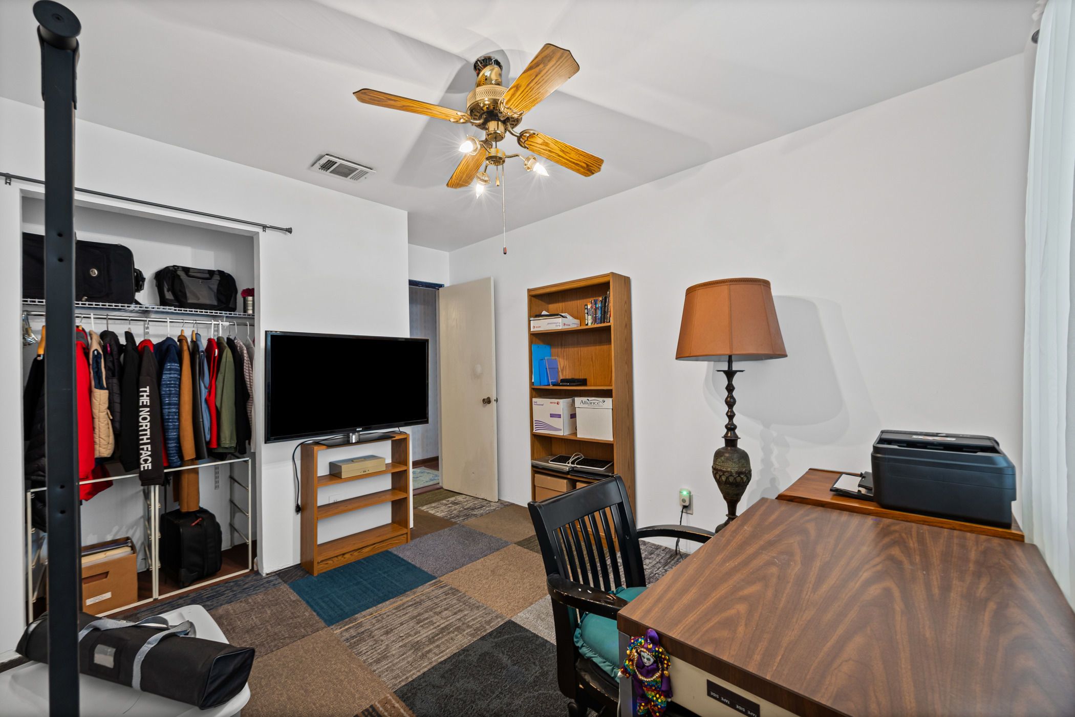 6300 Libyan Drive Austin, TX 78745 - Photo 26 of 35 a bedroom with furniture and a flat screen tv