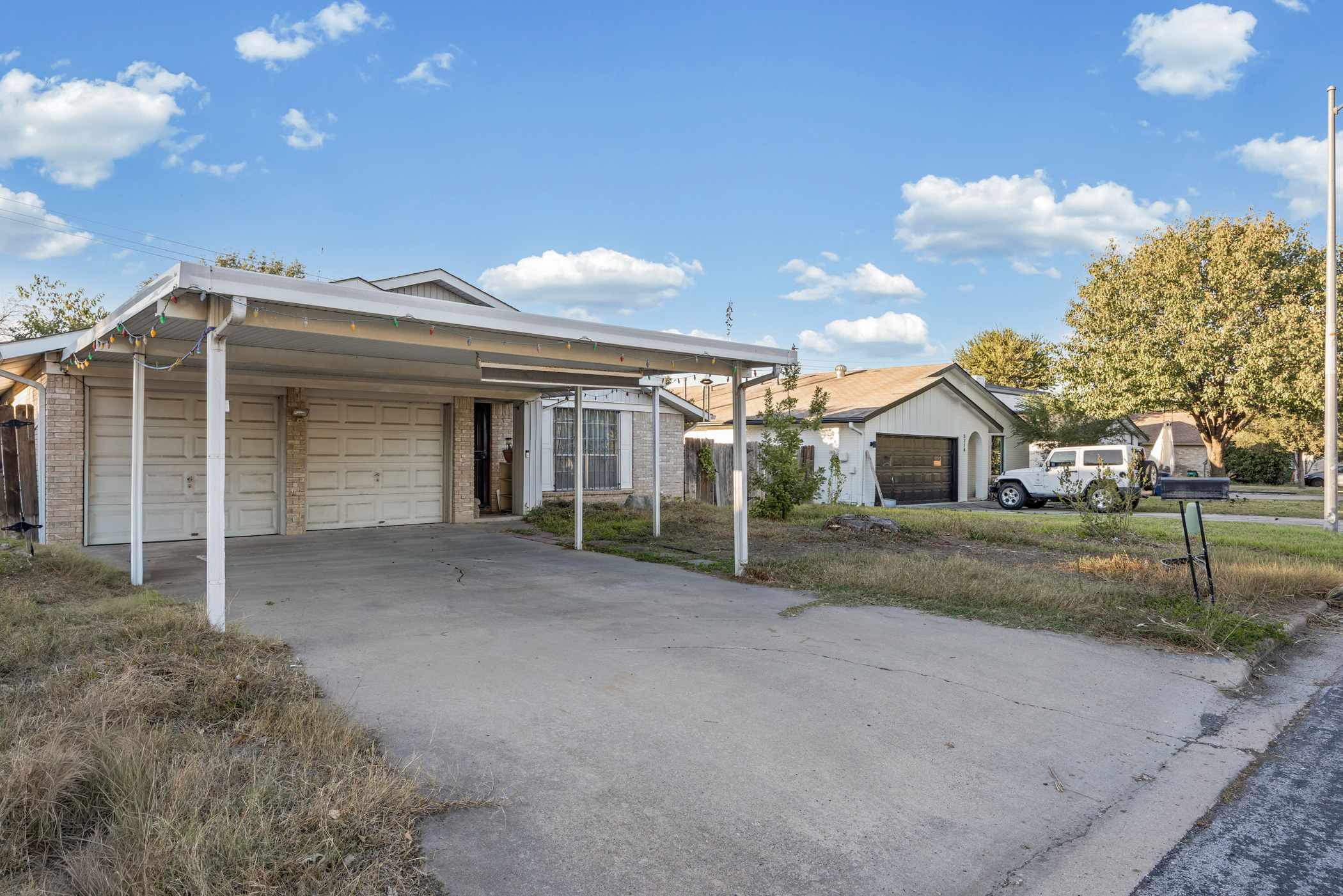 6300 Libyan Drive Austin, TX 78745 - Photo 4 of 35 a front view of a house with a yard and garage