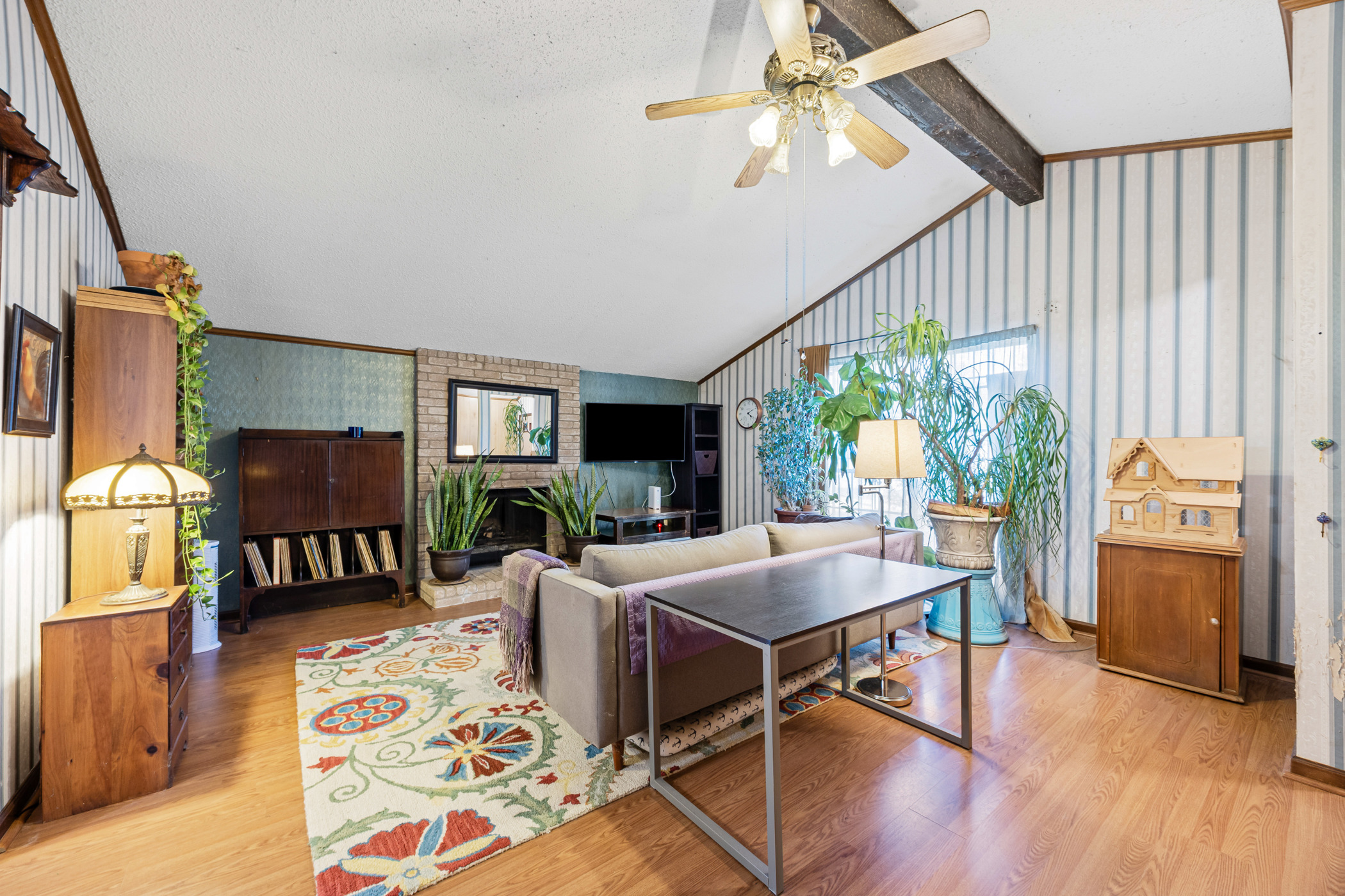 6300 Libyan Drive Austin, TX 78745 - Photo 10 of 35 a living room with furniture a fireplace and a flat screen tv