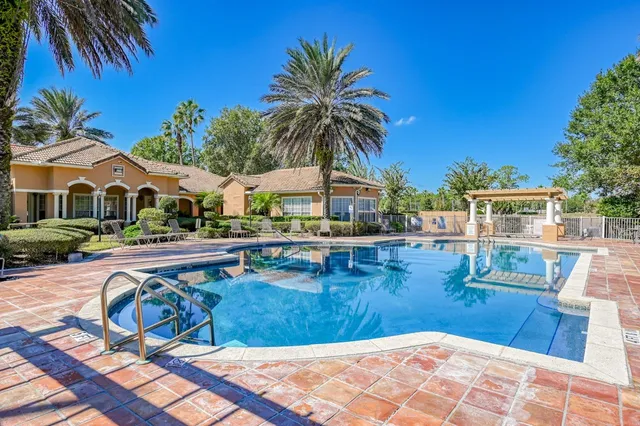 a view of swimming pool with chairs