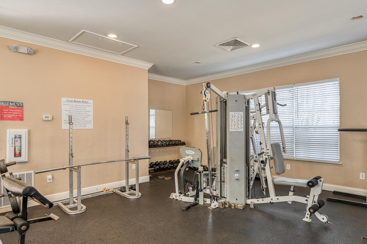 605 Fairway Drive, Unit 305 St. Augustine, FL 32084 - Photo 18 of 23 a view of a room with gym equipment