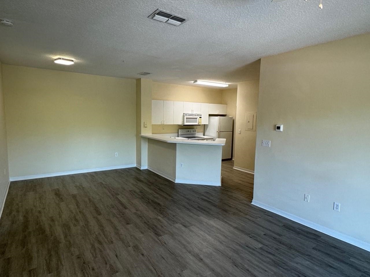 605 Fairway Drive, Unit 305 St. Augustine, FL 32084 - Photo 2 of 23 a view of kitchen and wooden floor