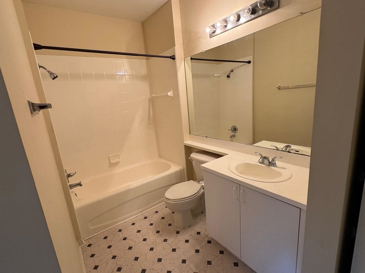 605 Fairway Drive, Unit 305 St. Augustine, FL 32084 - Photo 7 of 23 a bathroom with a sink a toilet and shower