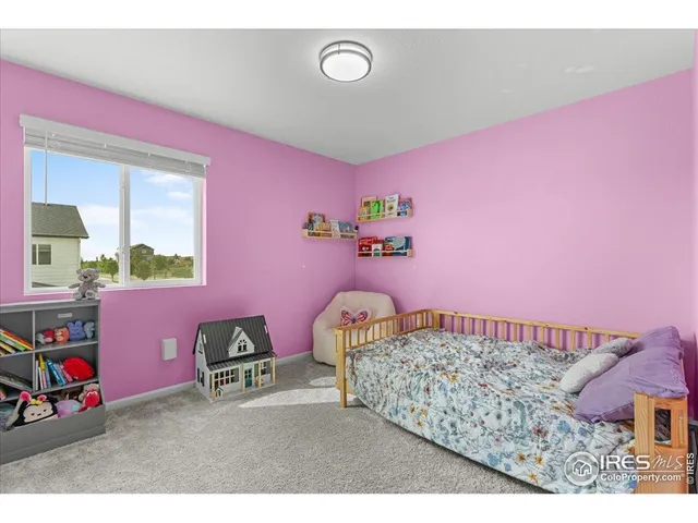 a view of a house with a big yard and large trees