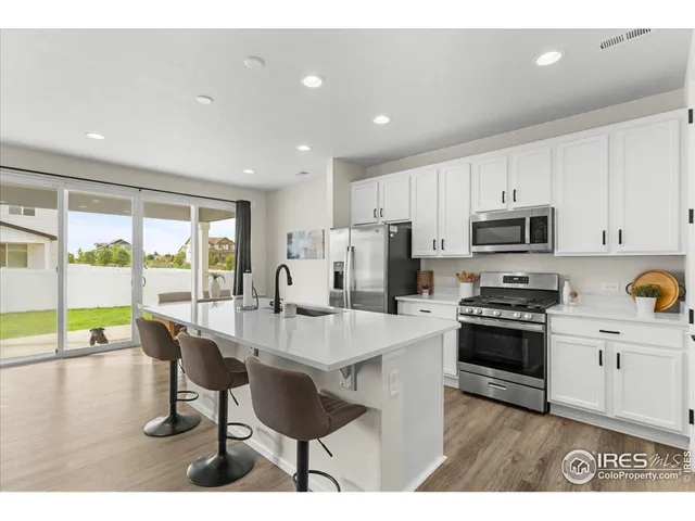 a kitchen with a sink and stove