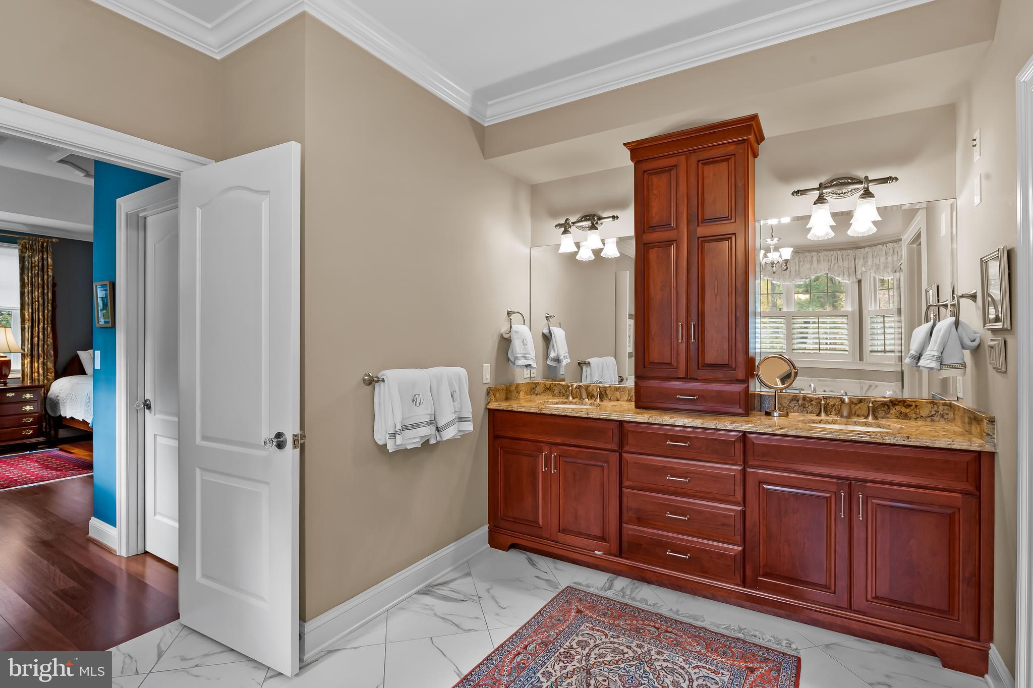 2049 Corbett Road Monkton, MD 21111 - Photo 36 of 66 a spacious bathroom with a granite countertop sink and a mirror