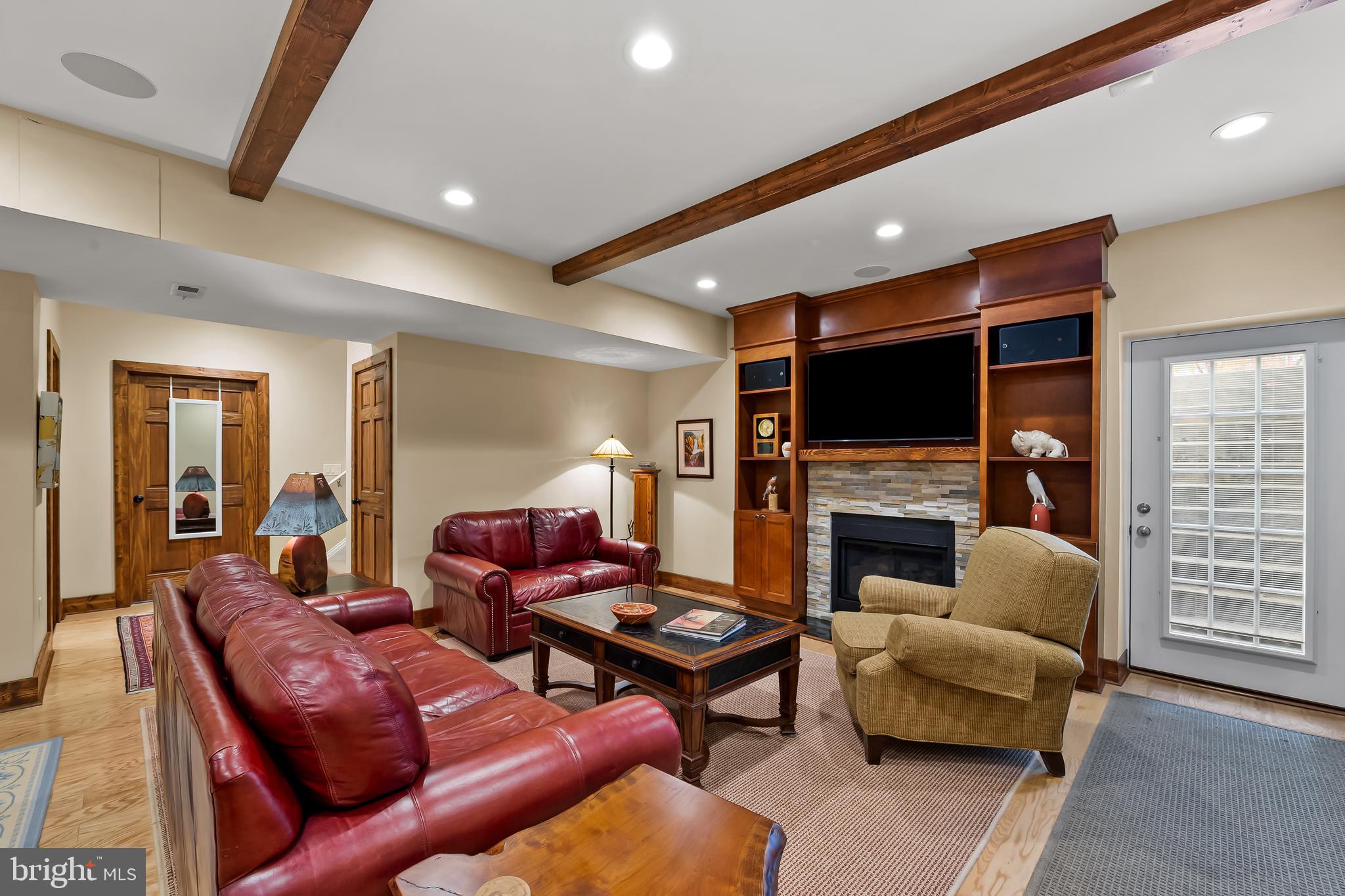 2049 Corbett Road Monkton, MD 21111 - Photo 49 of 66 a living room with fireplace furniture and a flat screen tv