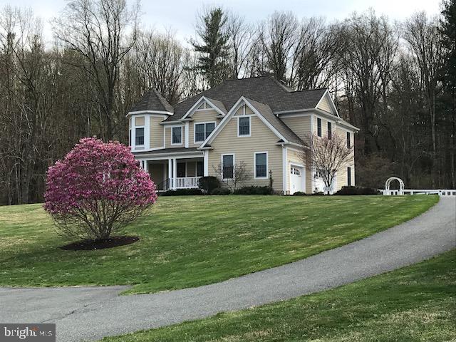 2049 Corbett Road Monkton, MD 21111 - Photo 60 of 66 a front view of a house with a garden