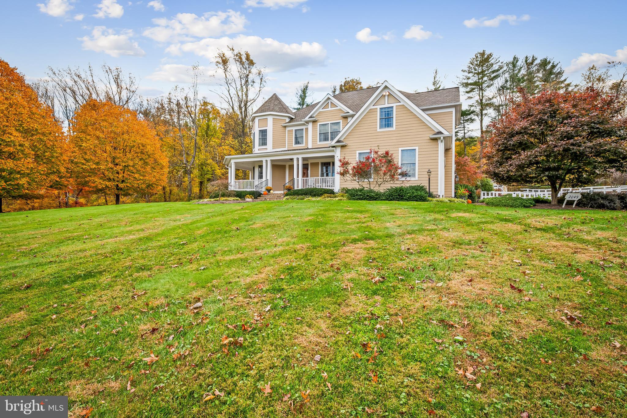 2049 Corbett Road Monkton, MD 21111 - Photo 66 of 66 a view of a big house with a big yard and large trees