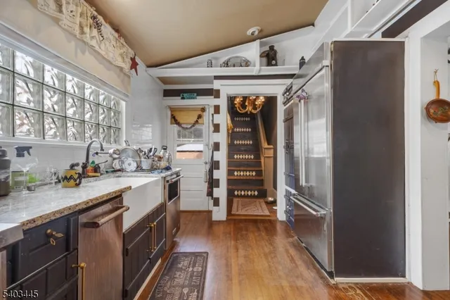 a kitchen with stainless steel appliances a stove and a refrigerator