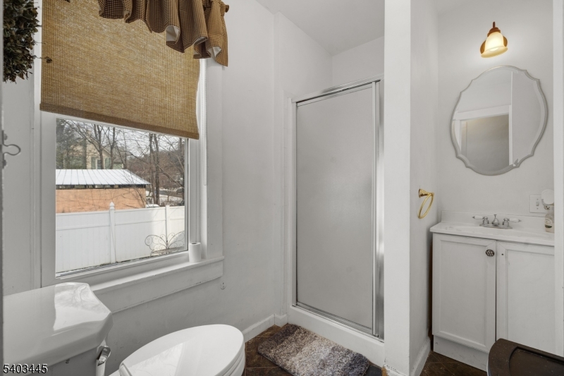 44 Main Street Califon, NJ 07830 - Photo 24 of 42 a bathroom with a toilet a sink and a mirror