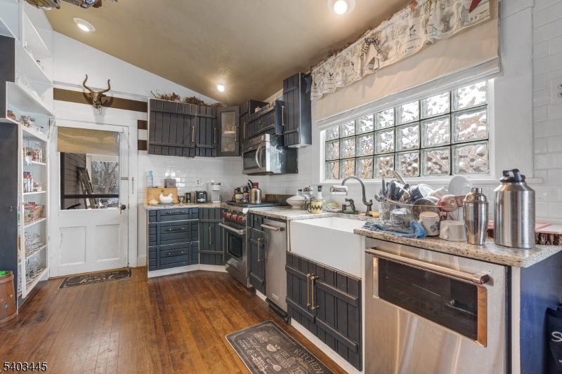 44 Main Street Califon, NJ 07830 - Photo 34 of 43 a kitchen with stainless steel appliances a stove sink and refrigerator