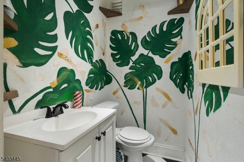 44 Main Street Califon, NJ 07830 - Photo 37 of 43 a vase of flowers sitting on a table with chairs