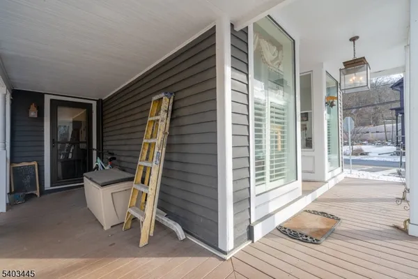 a view of a balcony with chairs
