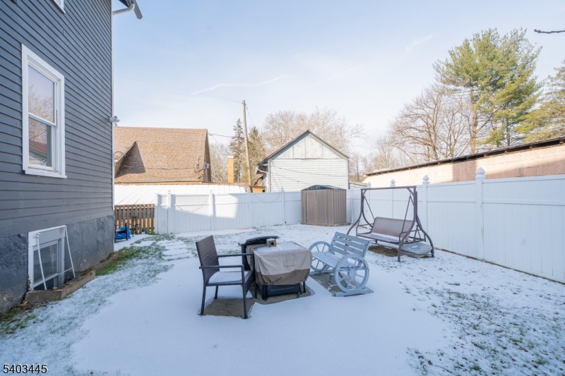 44 Main Street Califon, NJ 07830 - Photo 7 of 43 a view of a patio with couches and table and chairs with wooden fence