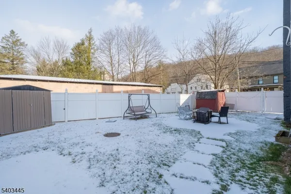 a view of a backyard of the house