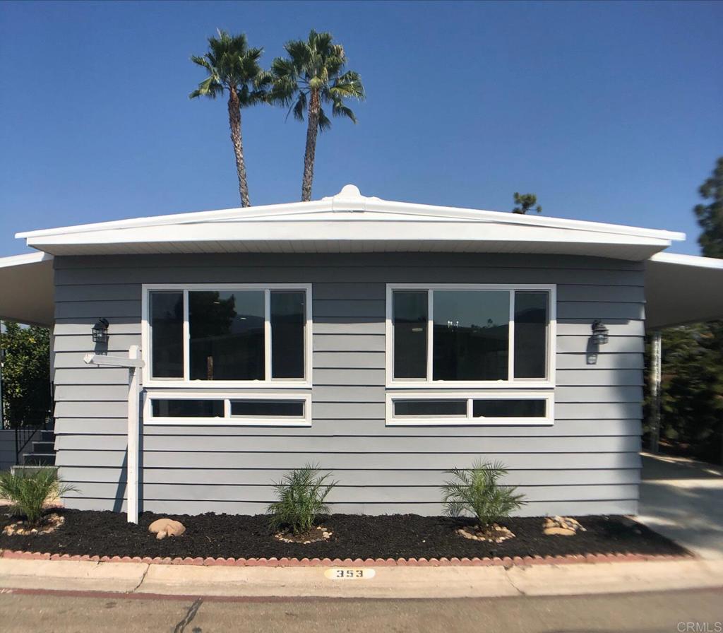 8301 Mission Gorge Road, Unit 353 Santee, CA 92071 - Photo 1 of 1 a front view of a house with a yard and garage
