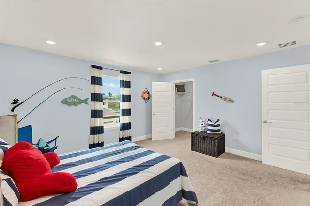 a bedroom with a bed and a dresser