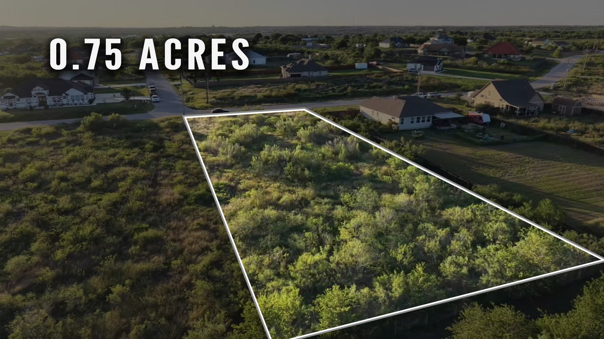 232 East Ridge Lane Kyle, TX 78640 - Photo 7 of 36 A spacious 0.75-acre lot with natural foliage awaits your vision.