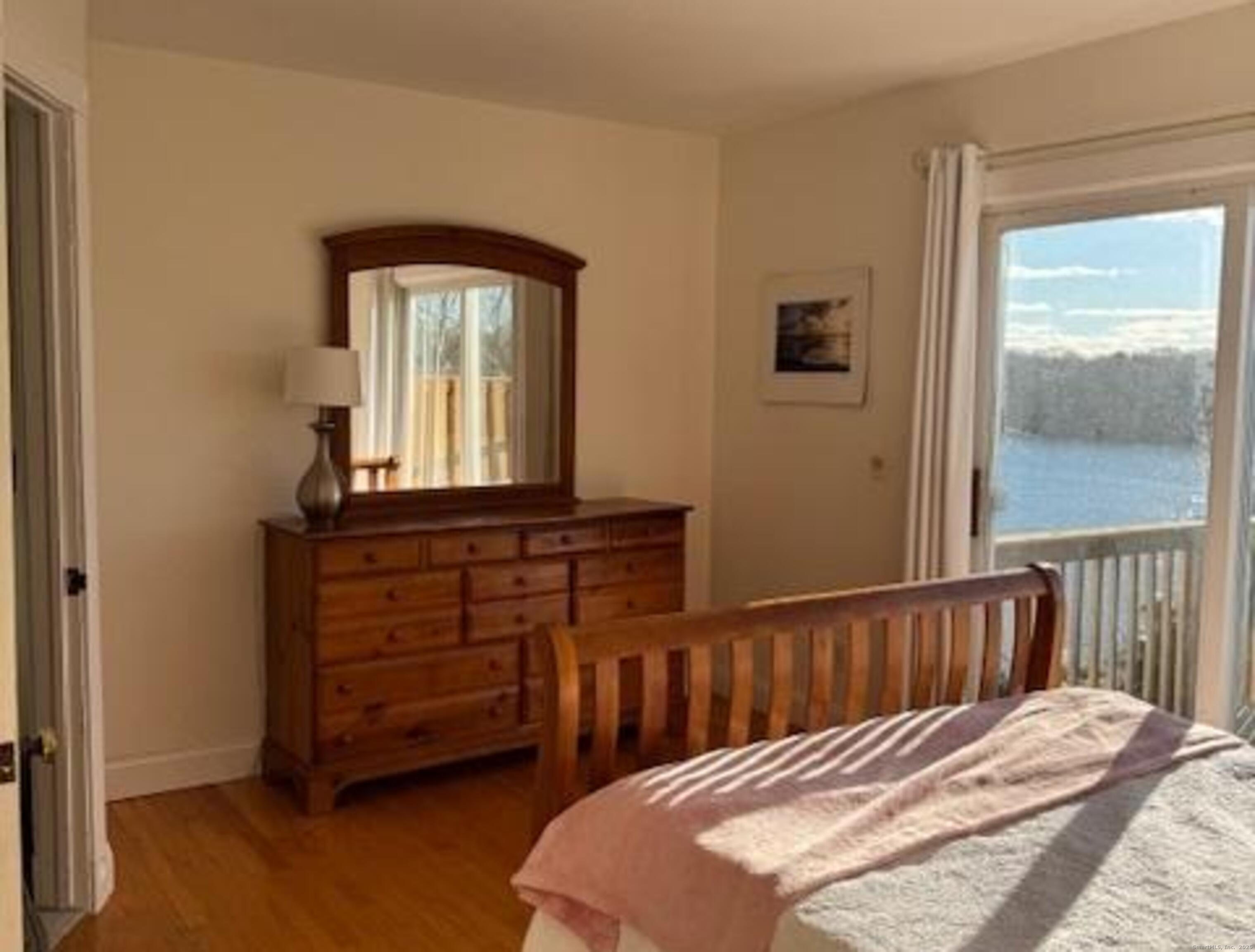123 Seneca Drive Groton, CT 06340 - Photo 20 of 25 a bedroom with a bed and a window