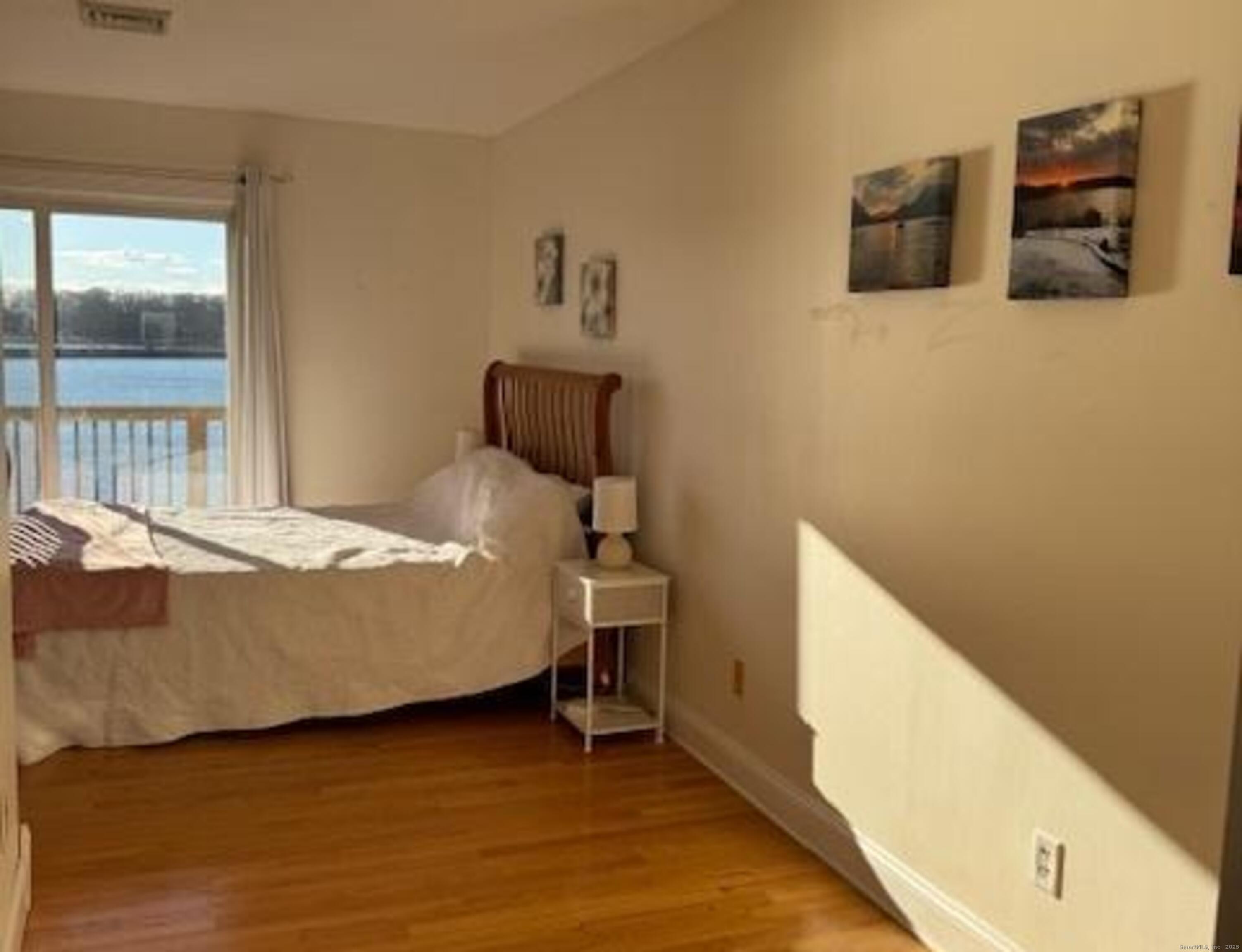 123 Seneca Drive Groton, CT 06340 - Photo 21 of 25 a bedroom with a bed and furniture