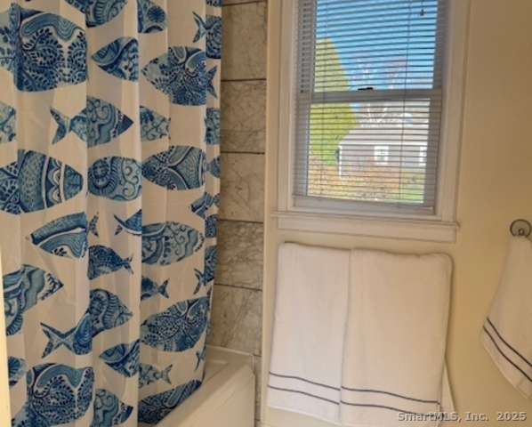 123 Seneca Drive Groton, CT 06340 - Photo 22 of 25 a view of a door and chair in a room