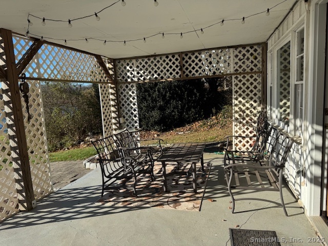 123 Seneca Drive Groton, CT 06340 - Photo 25 of 25 a view of a chairs and table in a patio