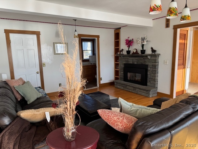 123 Seneca Drive Groton, CT 06340 - Photo 4 of 25 a living room with furniture and a fireplace