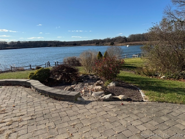 123 Seneca Drive Groton, CT 06340 - Photo 5 of 25 a view of a lake with a floor to ceiling window