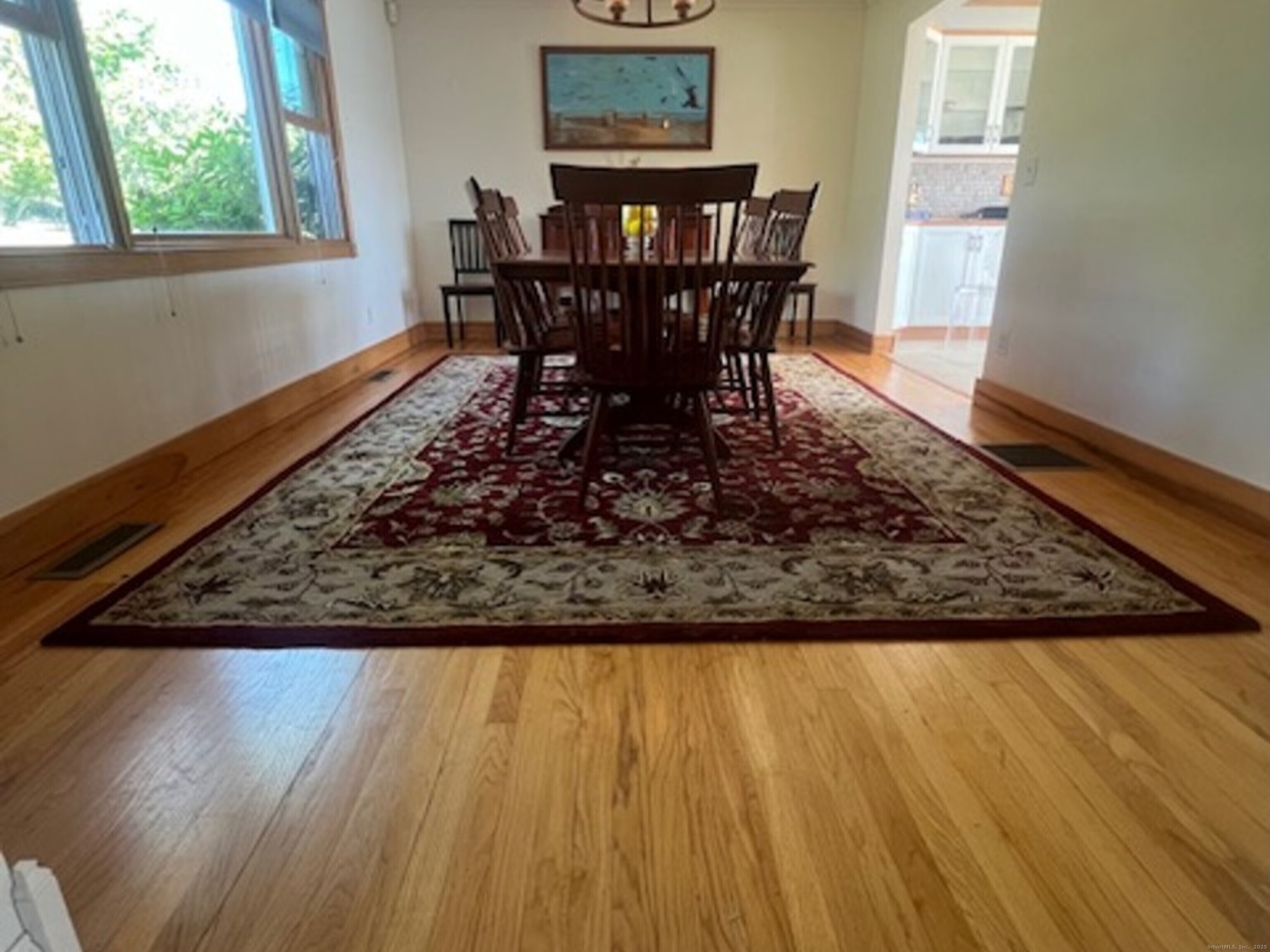 123 Seneca Drive Groton, CT 06340 - Photo 5 of 25 a view of a dining room with furniture and wooden floor