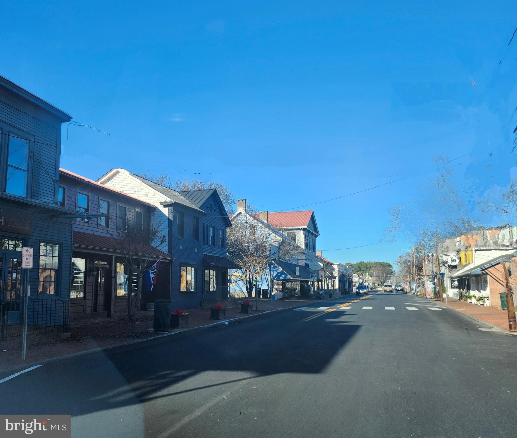 16 Meadow Street St. Michaels, MD 21663 - Photo 14 of 25 a city street lined with buildings and cars