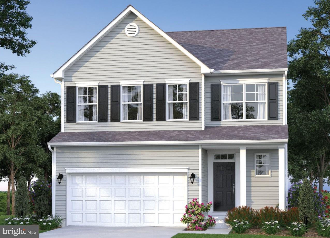 16 Meadow Street St. Michaels, MD 21663 - Photo 2 of 25 a front view of a house with a yard