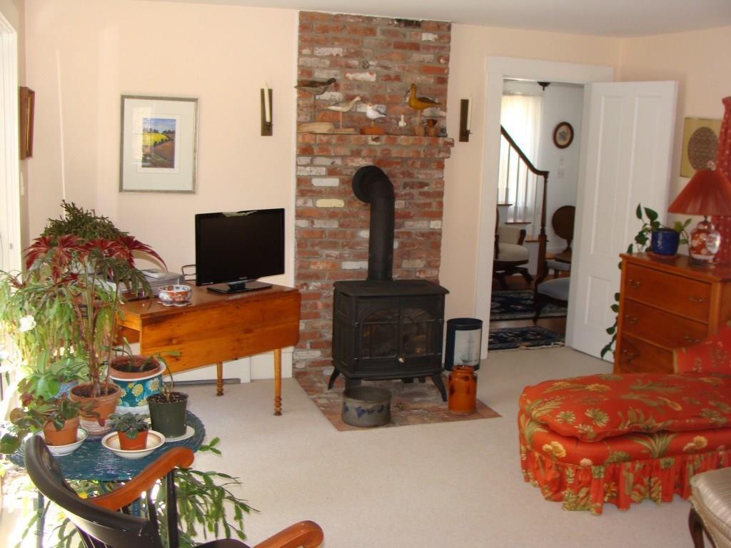 57 Clark Road York, ME 03909 - Photo 10 of 26 Cozy living room/den with gas stove.