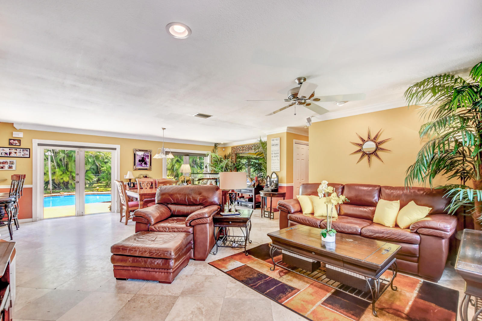 4542 Avalon Street Boca Raton, FL 33428 - Photo 12 of 51 a living room with furniture and a large window