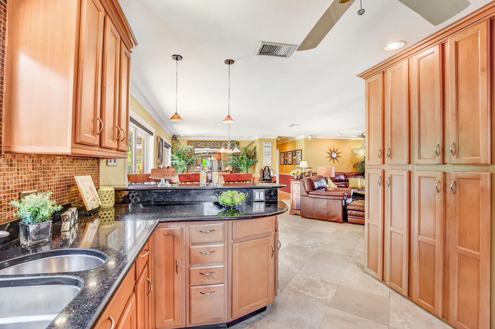 4542 Avalon Street Boca Raton, FL 33428 - Photo 17 of 51 a kitchen with stainless steel appliances granite countertop a sink and cabinets