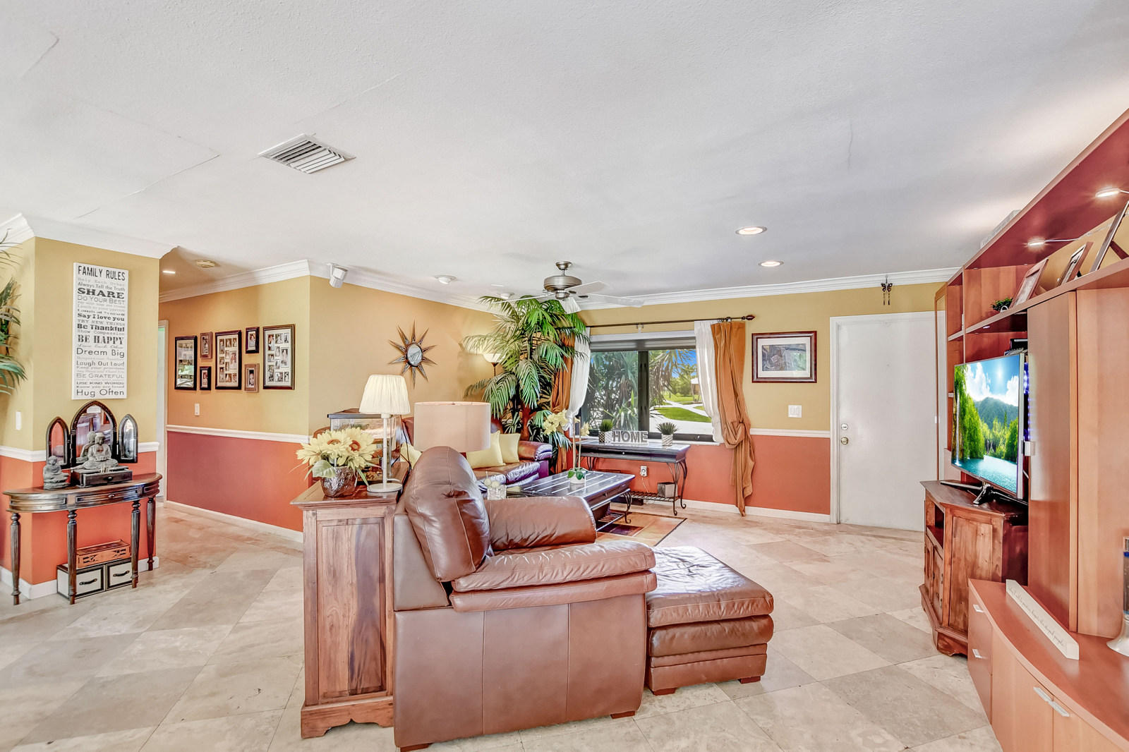 4542 Avalon Street Boca Raton, FL 33428 - Photo 21 of 51 a living room with furniture and a potted plant