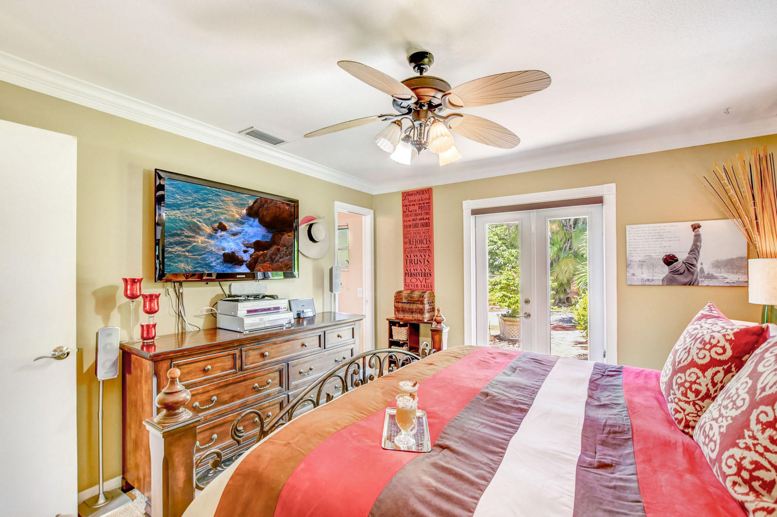 4542 Avalon Street Boca Raton, FL 33428 - Photo 23 of 51 a bedroom with a bed and a chandelier