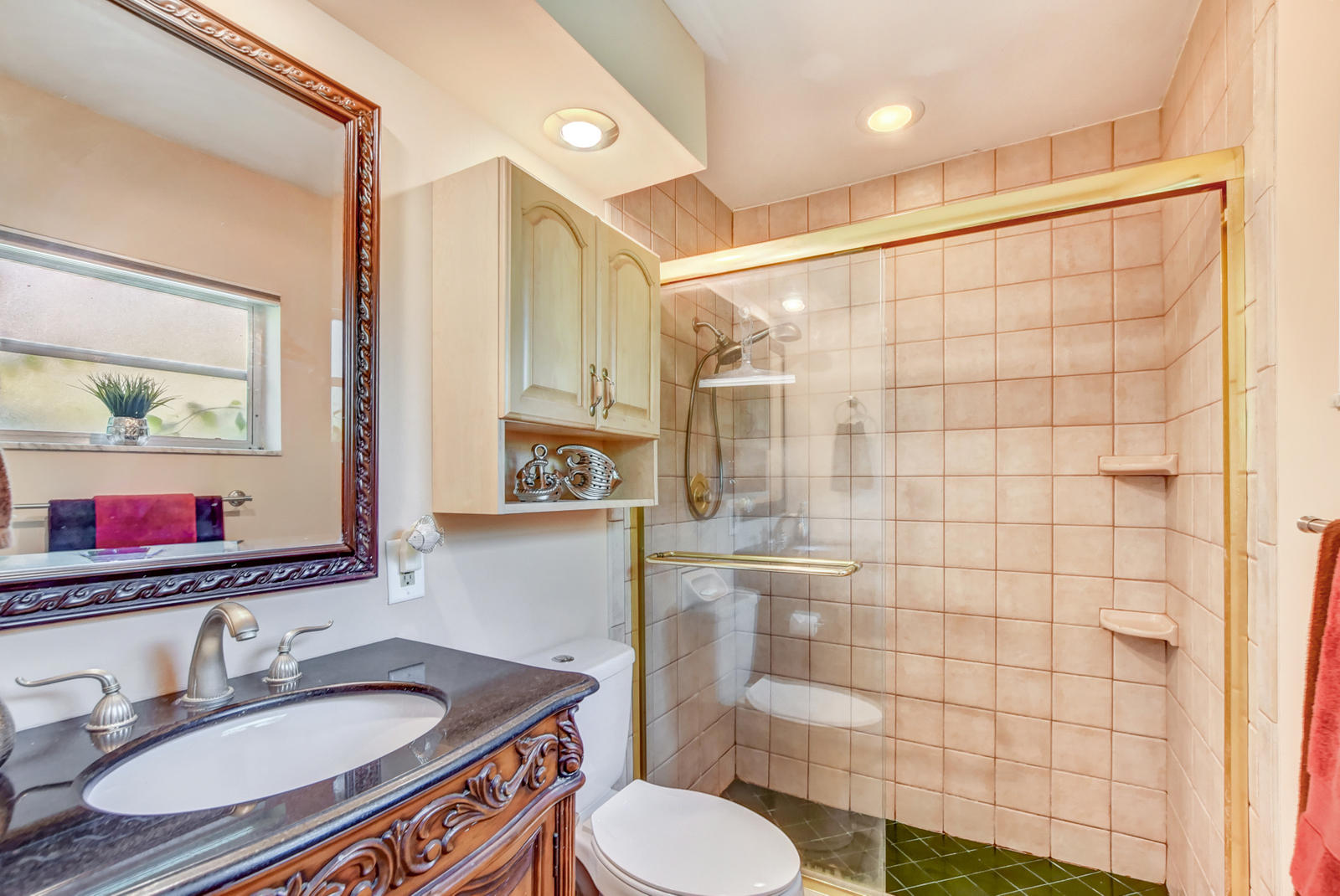 4542 Avalon Street Boca Raton, FL 33428 - Photo 24 of 51 a bathroom with a sink toilet a mirror and shower