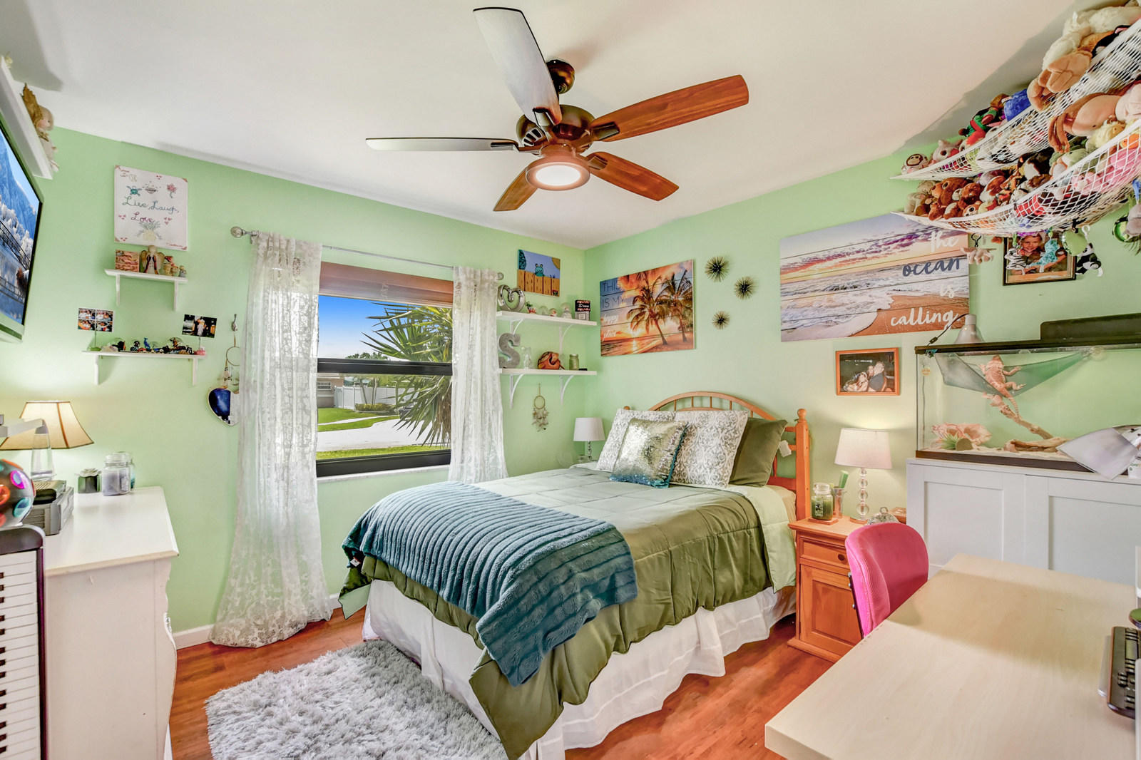 4542 Avalon Street Boca Raton, FL 33428 - Photo 25 of 51 a bedroom with a bed and a chandelier