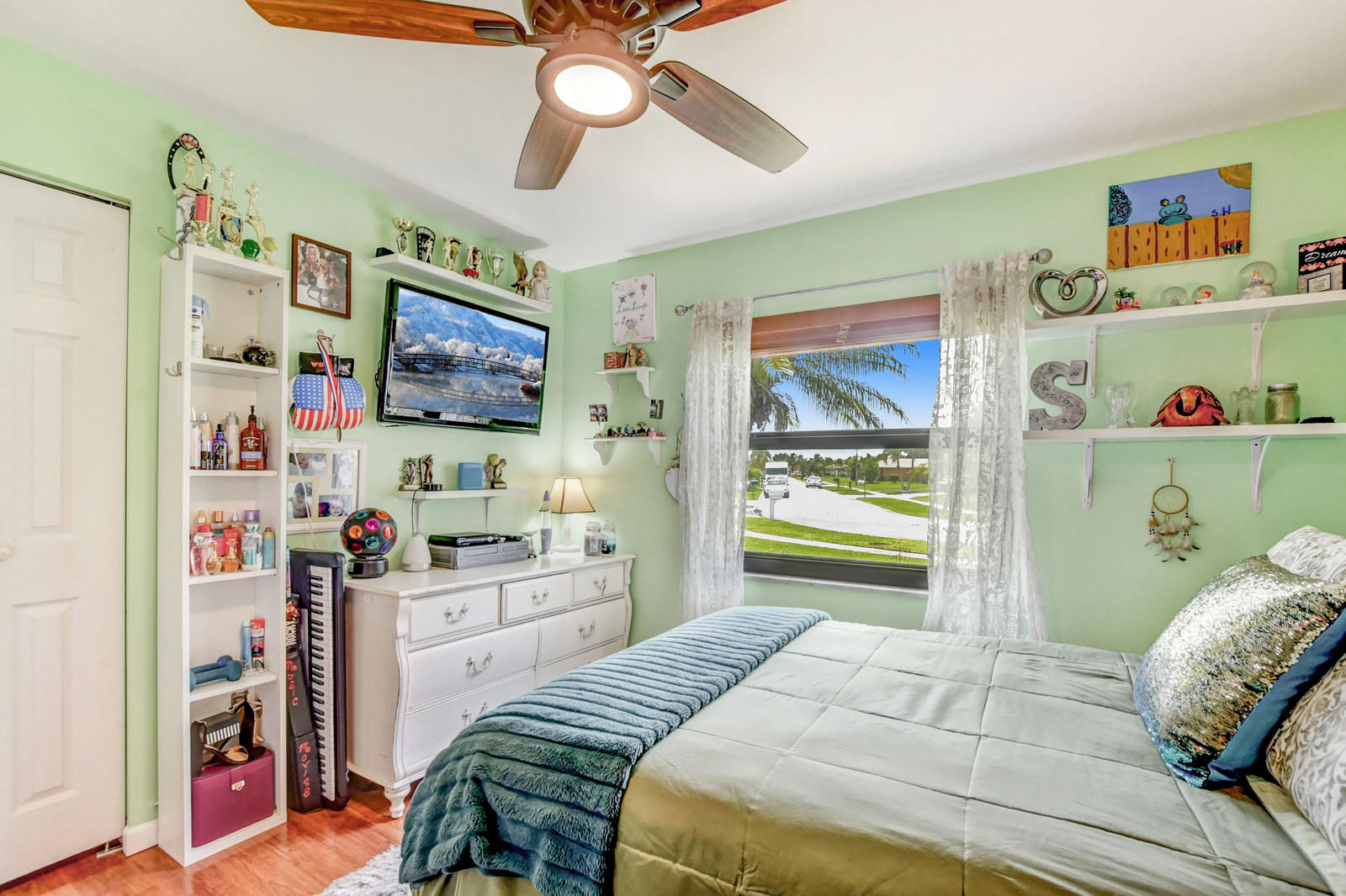 4542 Avalon Street Boca Raton, FL 33428 - Photo 26 of 51 a bedroom with a bed and a window