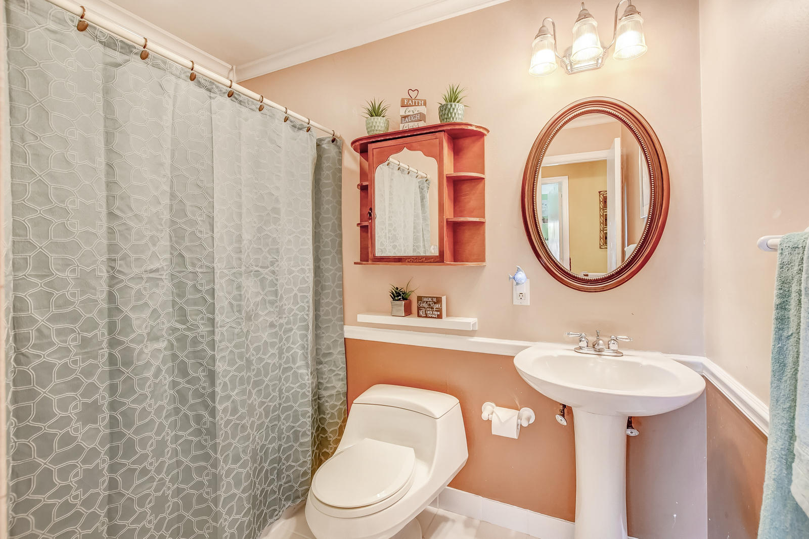 4542 Avalon Street Boca Raton, FL 33428 - Photo 27 of 51 a bathroom with a sink a mirror a toilet and a mirror