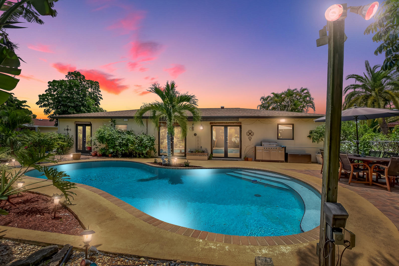 4542 Avalon Street Boca Raton, FL 33428 - Photo 31 of 51 a view of swimming pool with seating space and garden