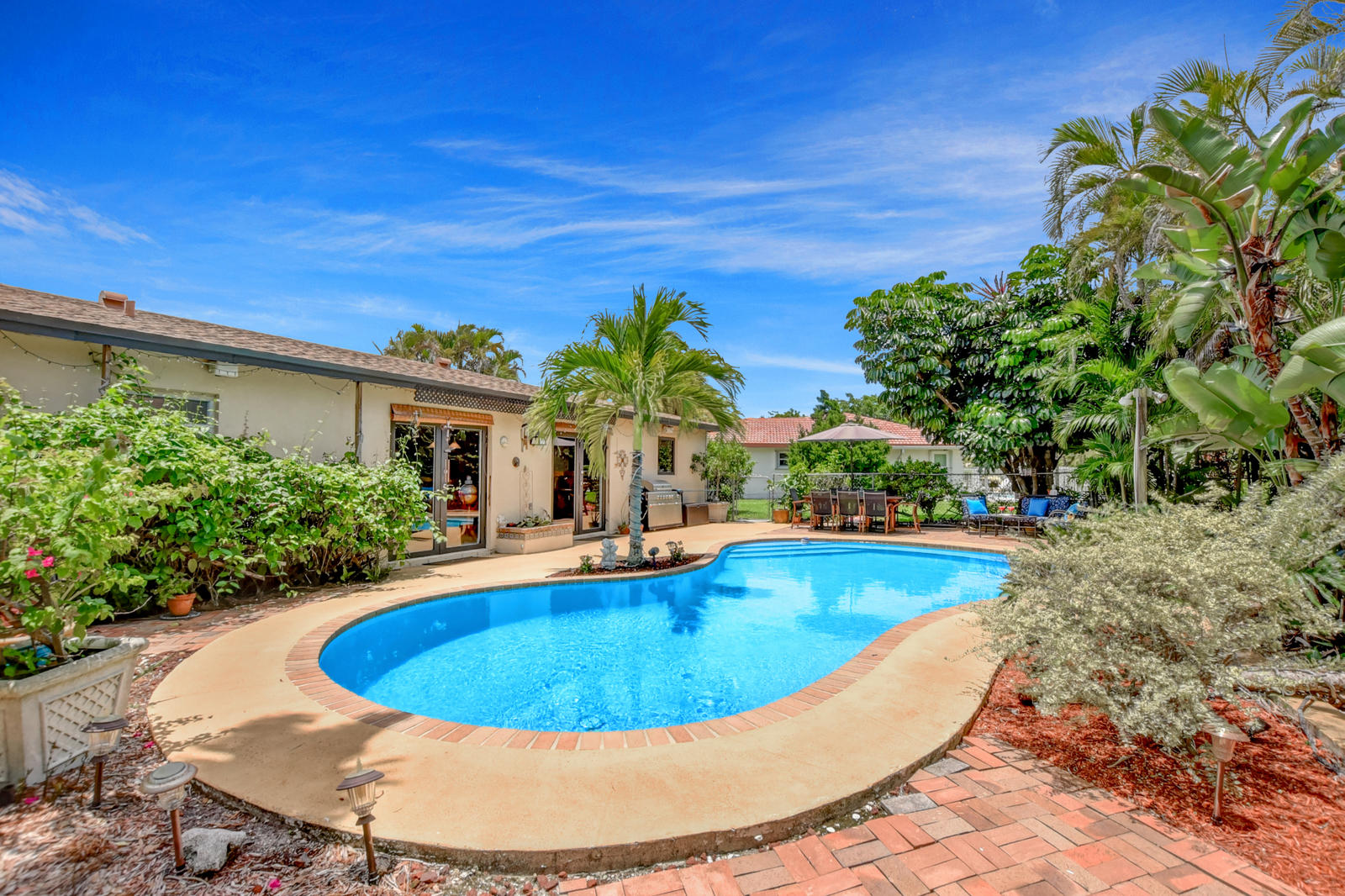4542 Avalon Street Boca Raton, FL 33428 - Photo 33 of 51 a view of a swimming pool with an outdoor space